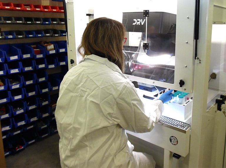 DRV in cabinet 768x572px Lab technicial preparing sample using DRV in cabinet
